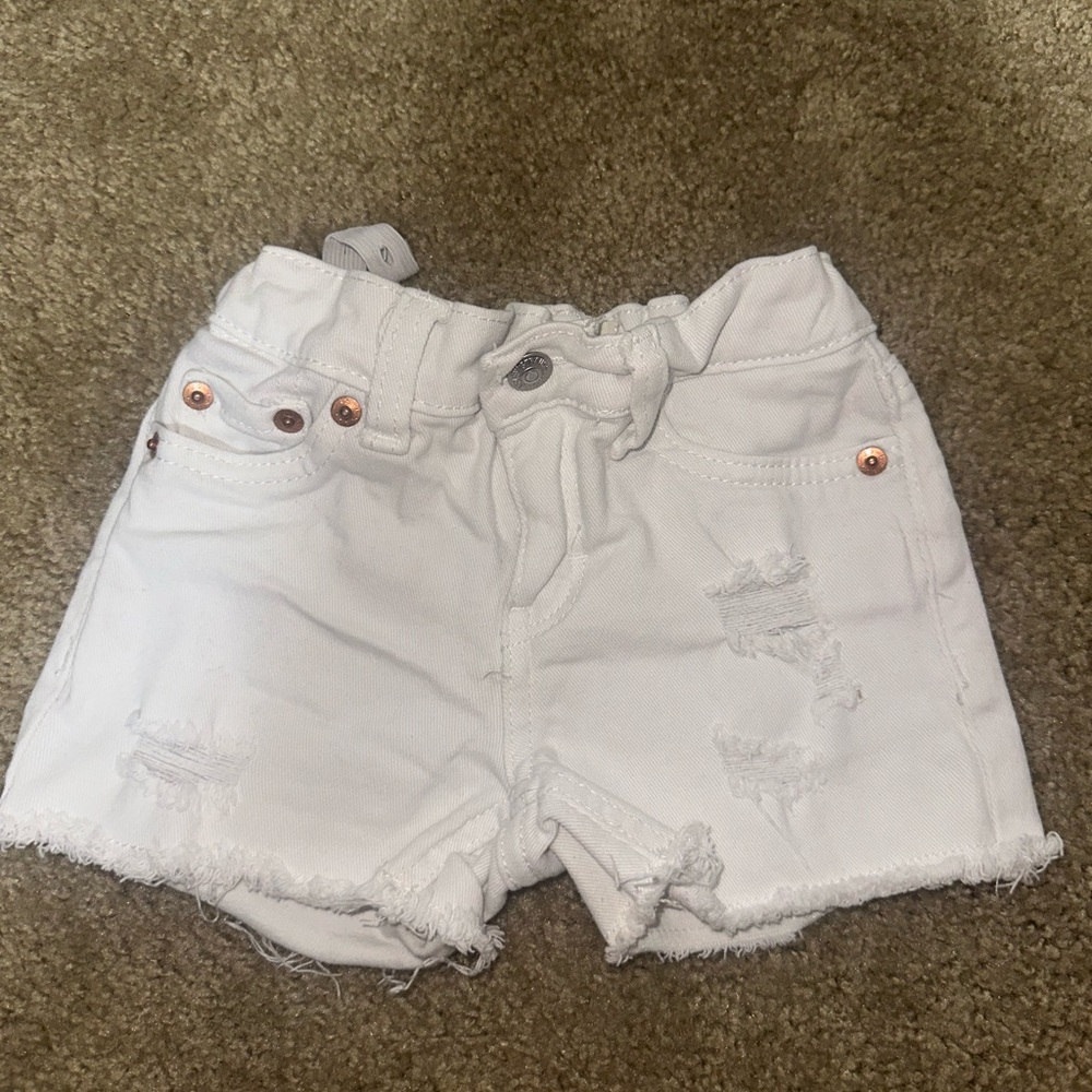 Levi's White Distressed Jean Shorts with Frayed Hem